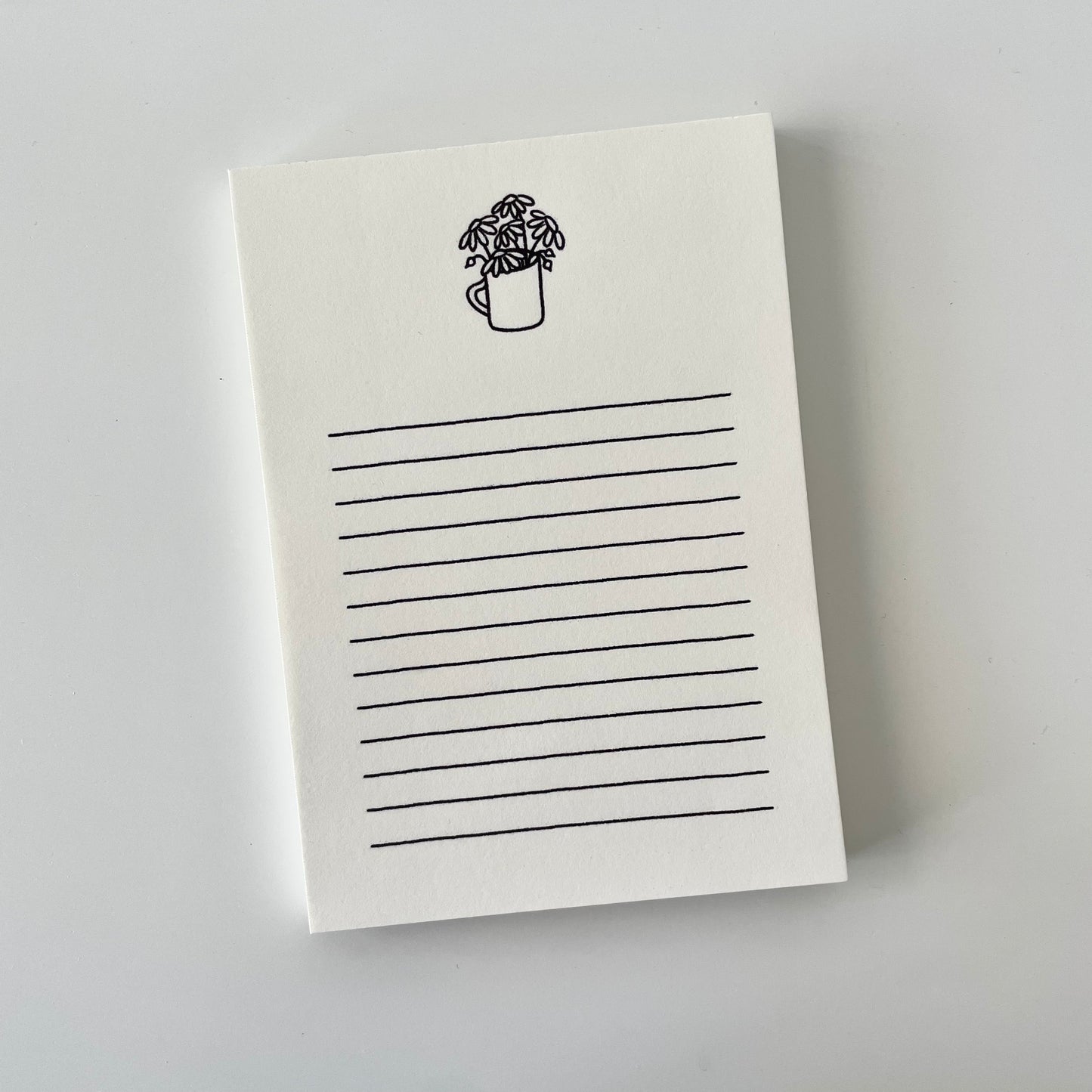 Daisies In A Cup Cream A6 Notepad