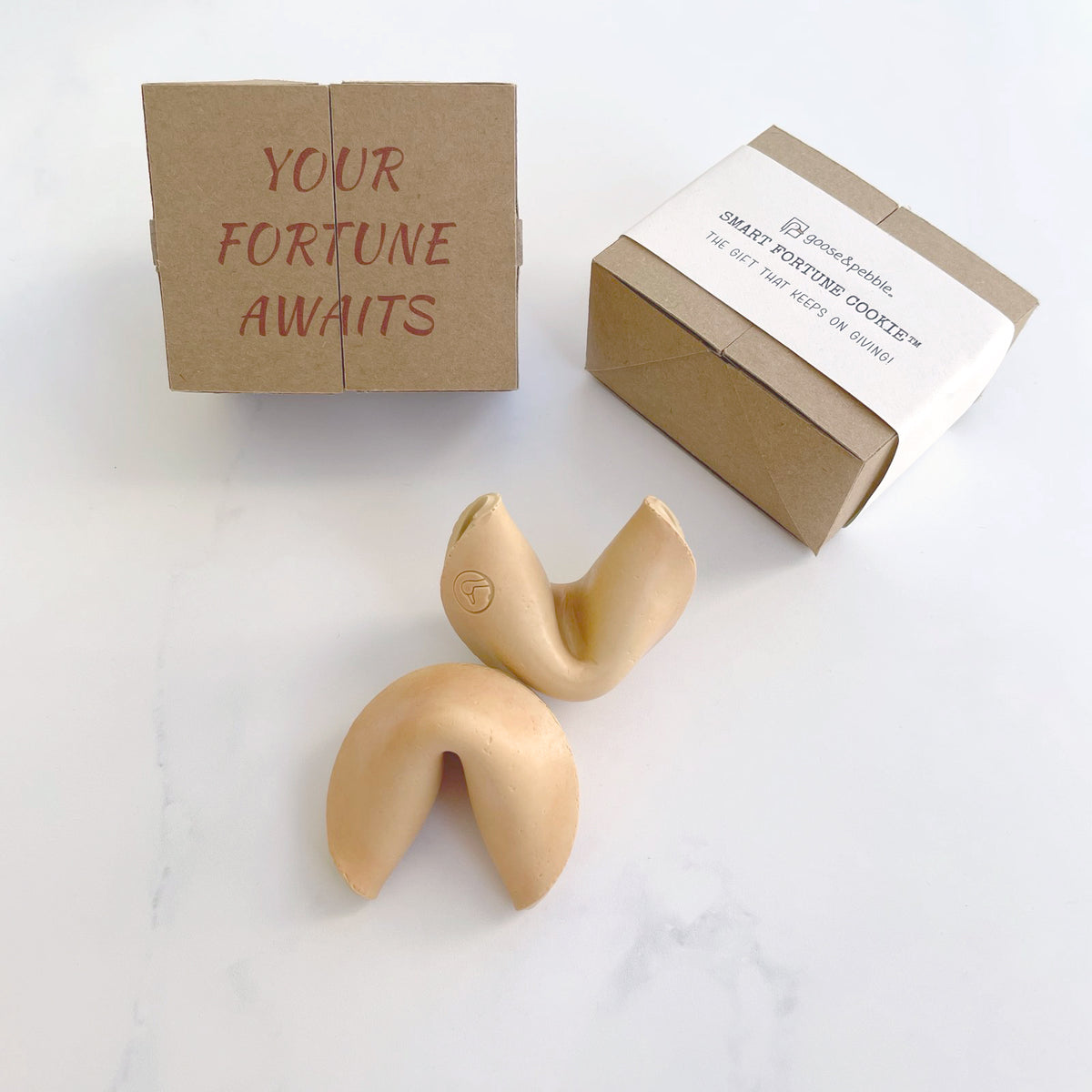 Two Smart Fortune Cookies with their kraft gift boxes, one printed “Your fortune awaits”