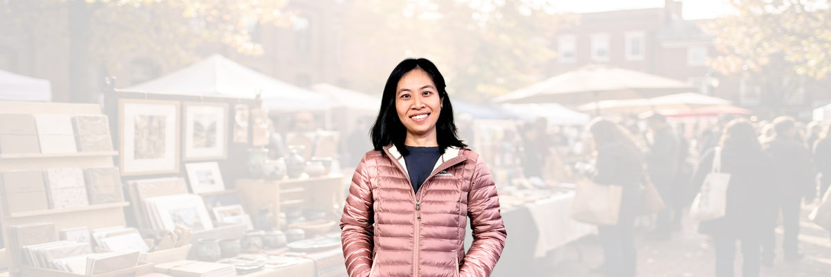 Melissa, founder of Goose & Pebble, at an outdoor market