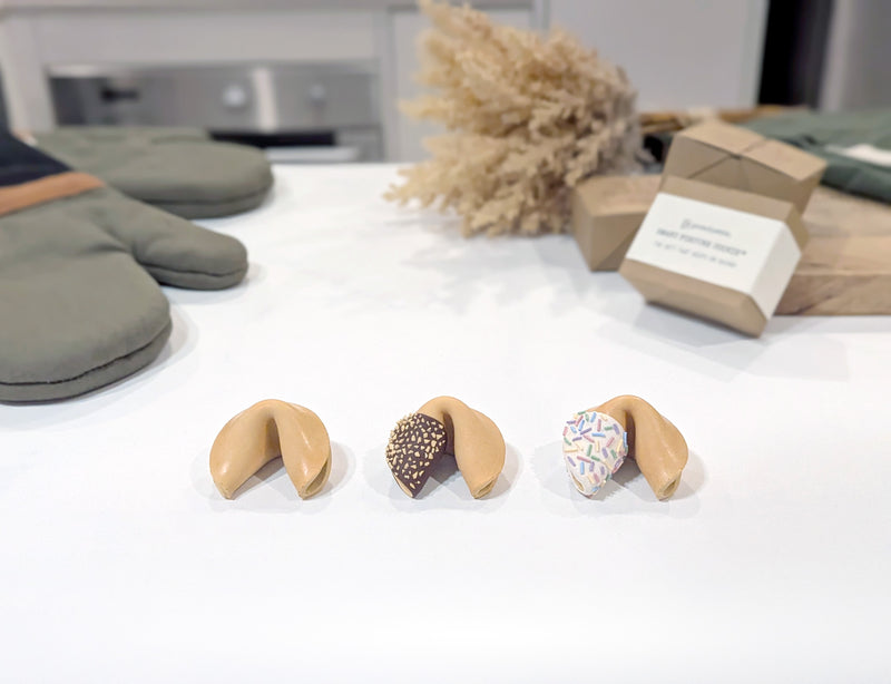 The Original, Fortu-Nut and Rainbow Sprinkle Smart Fortune Cookies in a row, with their gift box behind